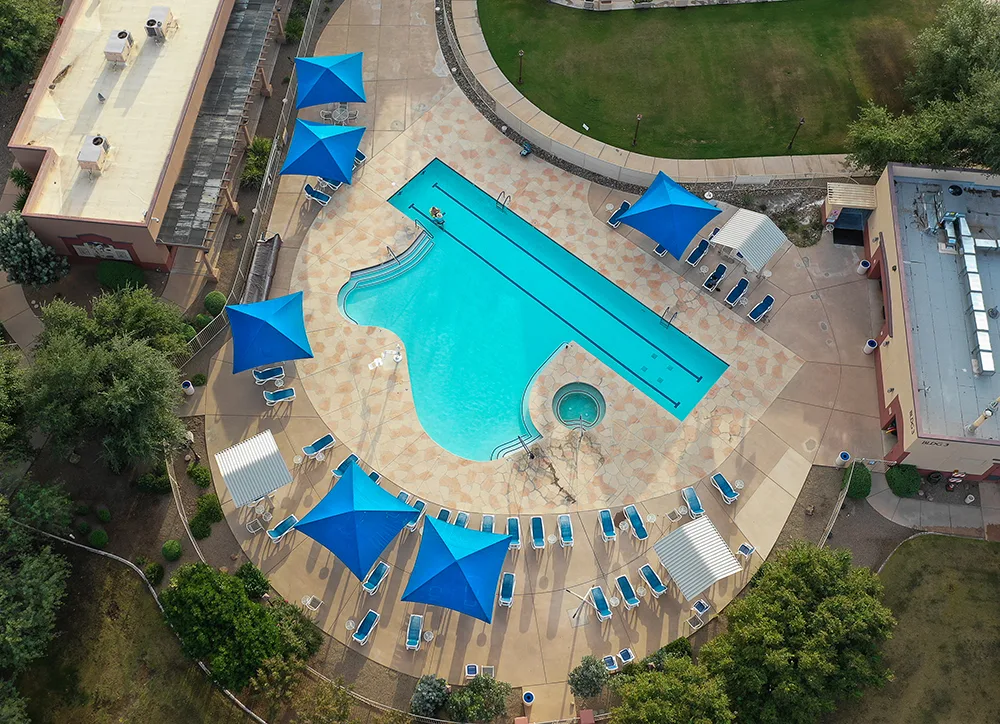 aerial view of pool with umbrellas
